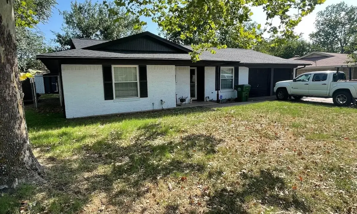 Professional roofing crew working on a residential roof in Cape St. Claire